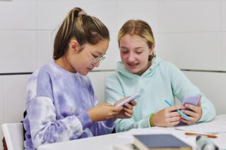 two girls on phones